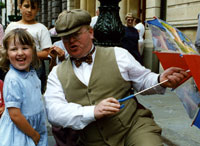 Working the crowds as a street entertainer.