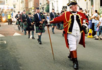At the head of a city procession.