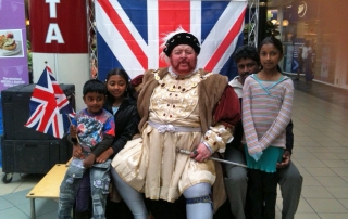 Henry VIII greet some local children