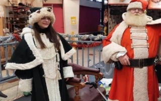 Alan Myatt dressed as Father Christmas, giving our presents to children